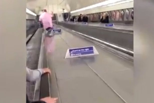 Man-uses-tube-escalator-as-a-slide (1)