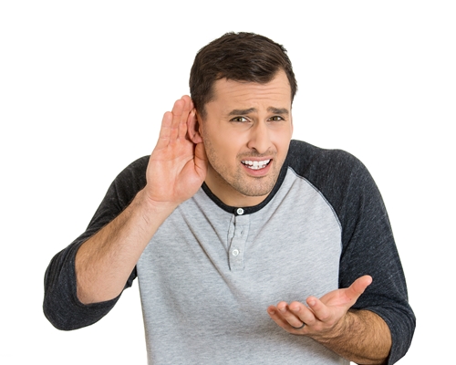 man having difficulty in hearing