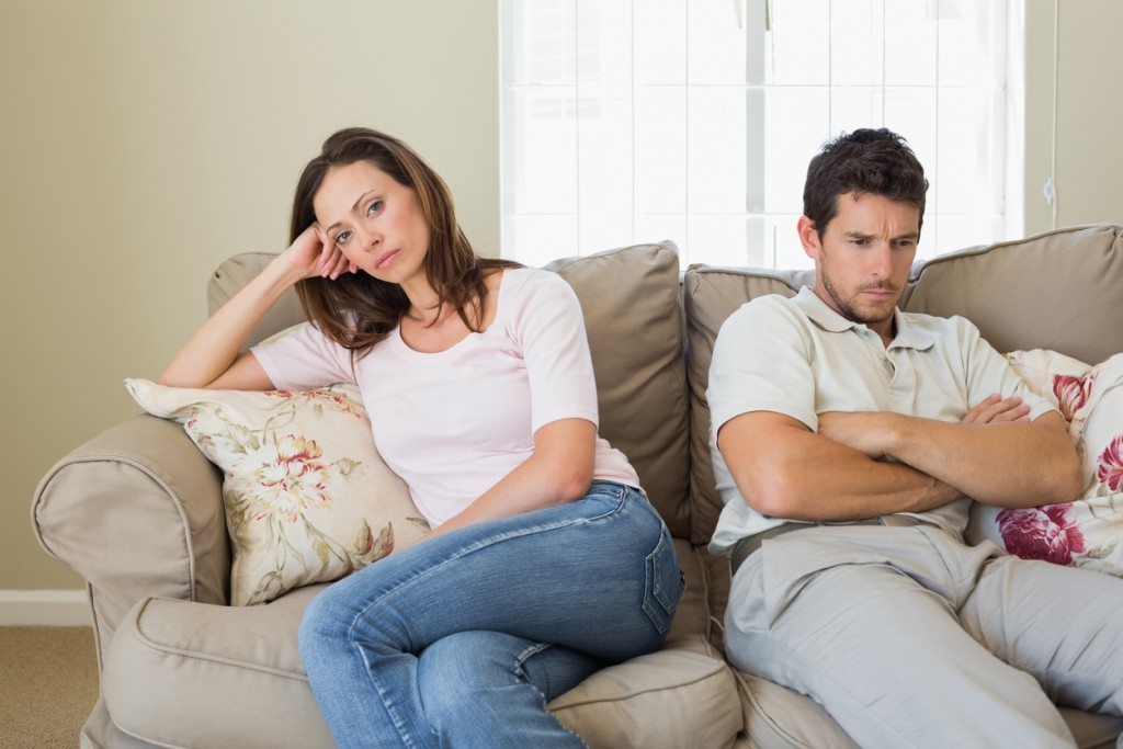 Couple having an argument in living room