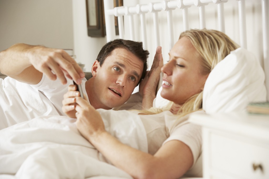 Husband Complaing As Wife Uses Mobile Phone In Bed