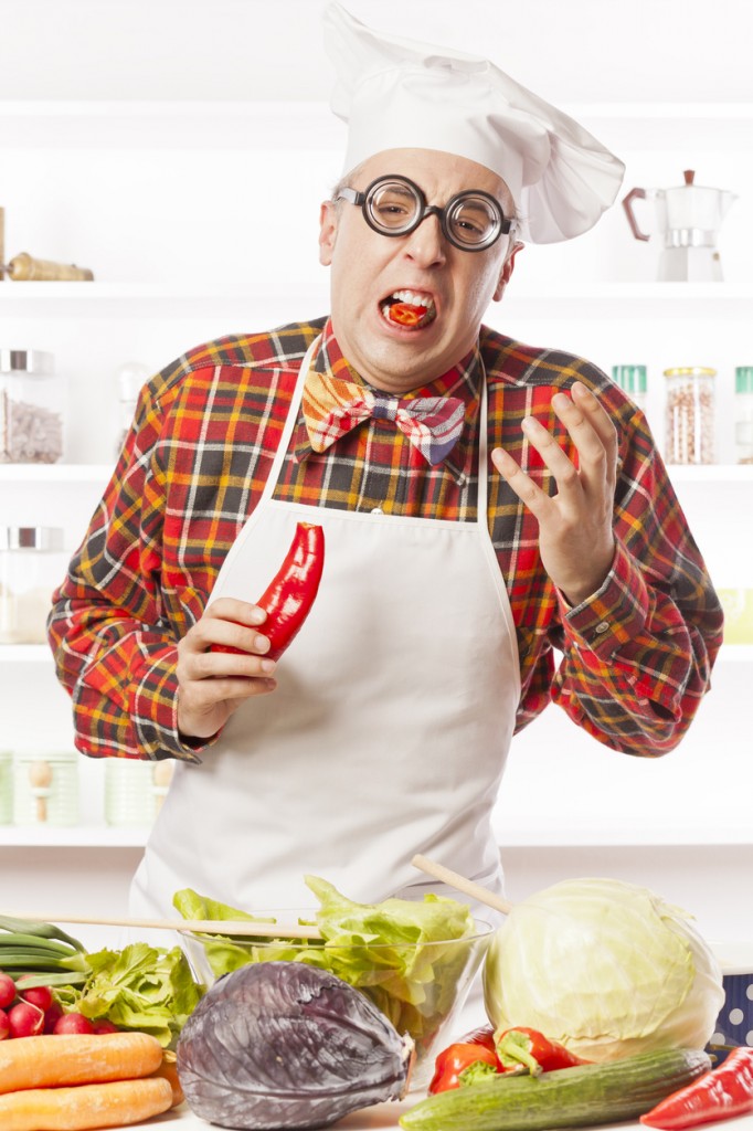 Nerdy chef preparing fresh salad