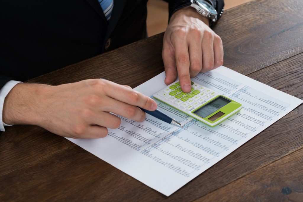 Businessperson Working With Accounting Document