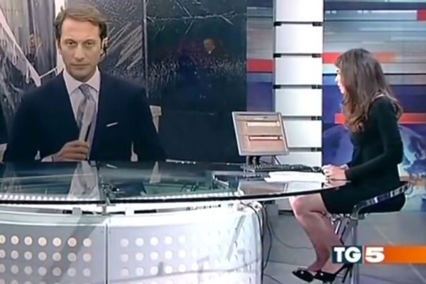 news-presenter-suffers-wardrobe-malfunction-after-she-forgets-shes-sitting-at-a-glass-desk