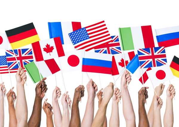 Multiethnic and Diverse Hands Holding National Flags