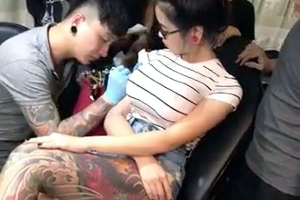PAY-Hilarious-moment-a-Tattooist-gets-shock-as-clients-boob-explodes-during-Tattoos