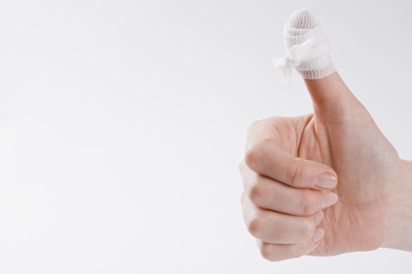 Person with bandage on thumb