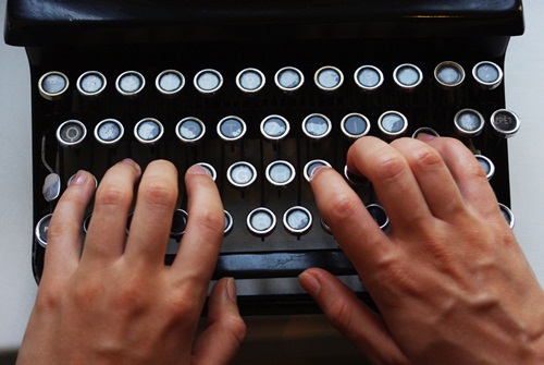 Detail of the keyboard, typewriter with two hands