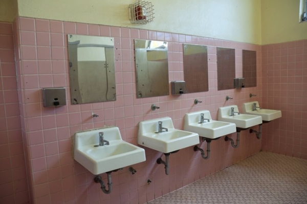 Pink girls bathroom in a public high school