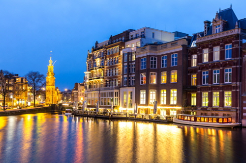 Munttoren Tower at Muntplein square Amsterdam Netherlands at dusk