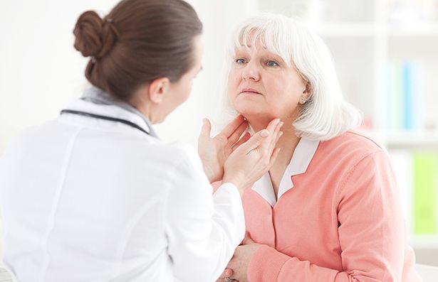 A-doctor-check-out-a-patients-thyroid