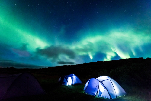 Camp with Northern lights in Iceland
