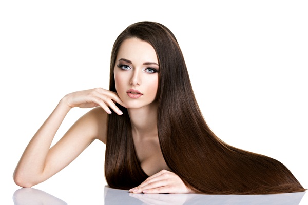 Portrait of beautiful young woman with long straight brown hair